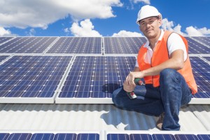 Solar panels with Electric Company Worker